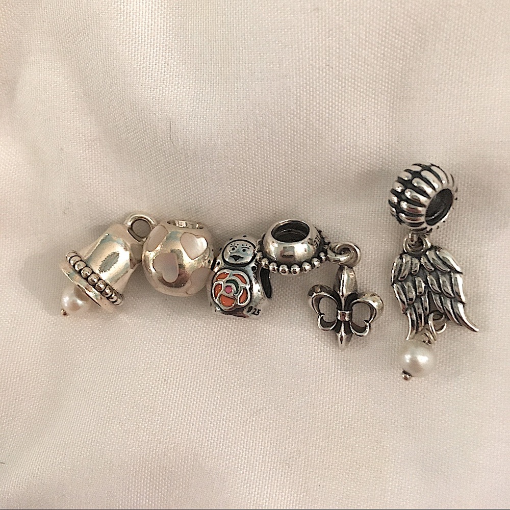 Pandora. Bell;hearts;matryoshka;fleur-de-lis;wings